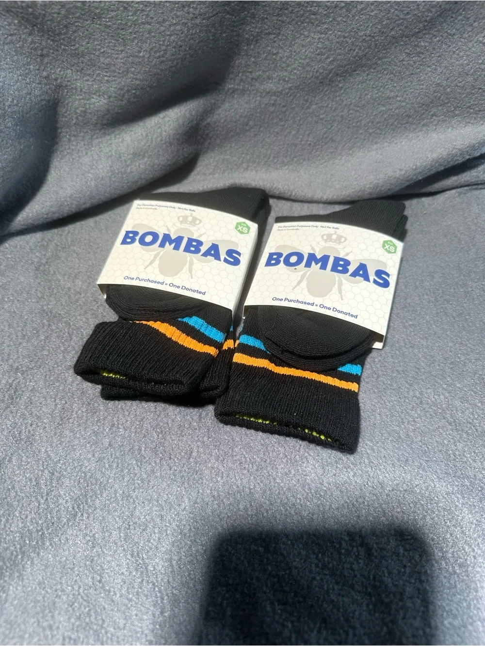Bombas Black Crew Socks with Blue and Orange Stripe Accents